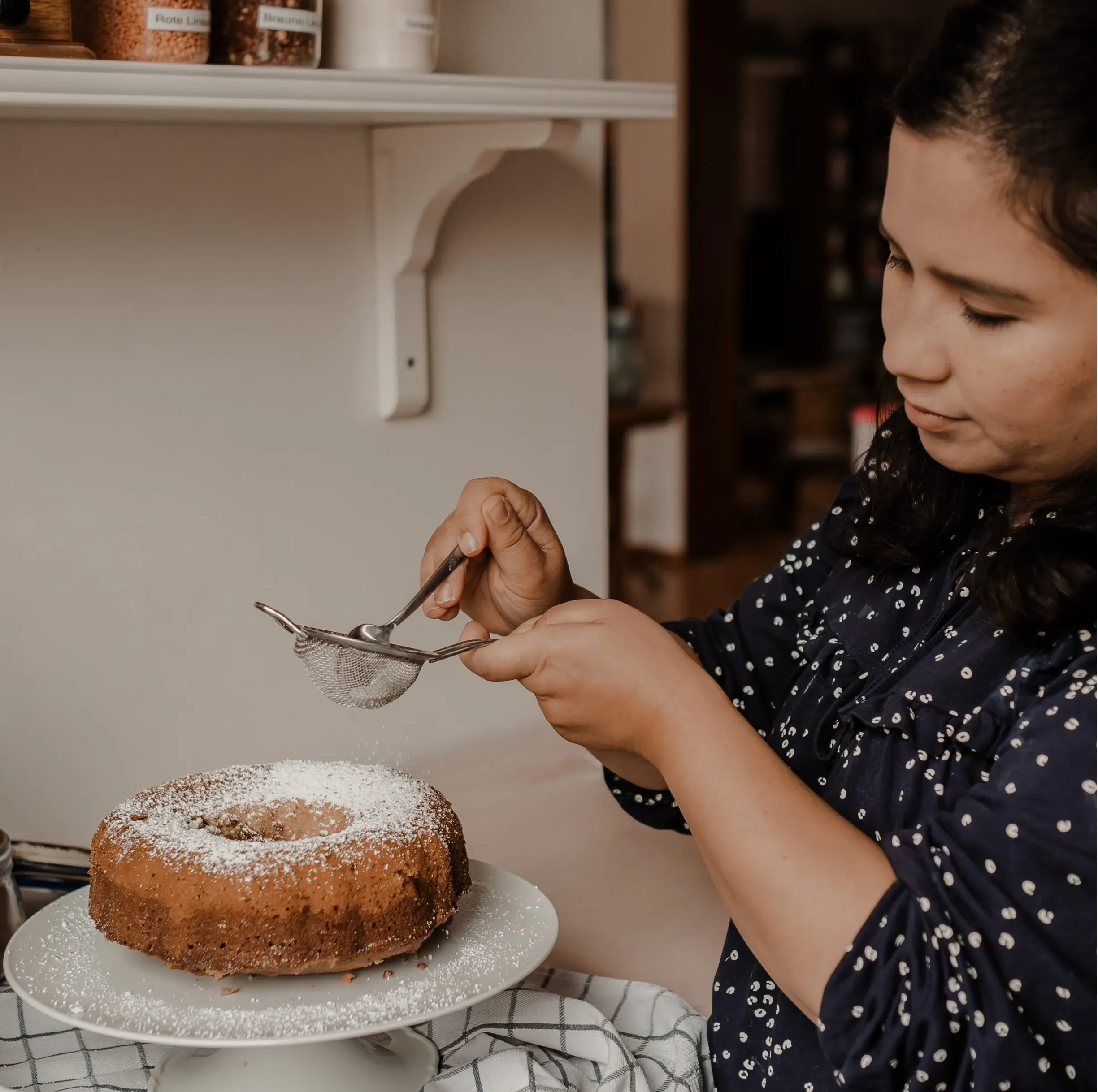 Marita sprinkles powdered sugar